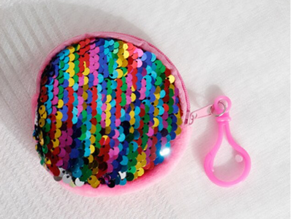 Round plush purse in pink with rainbow sequins