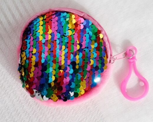 Round plush purse in pink with rainbow sequins